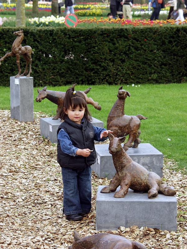 P4176115.jpg - I don't know who she is but she is very cute trying to feed the animals.