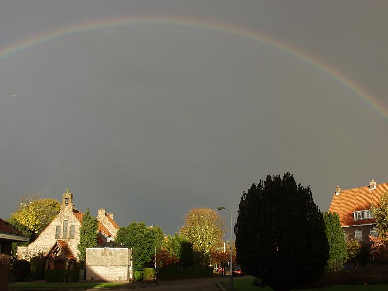 PB187751.jpg - This is Marlot out the front window.  Rainbow over the French church.