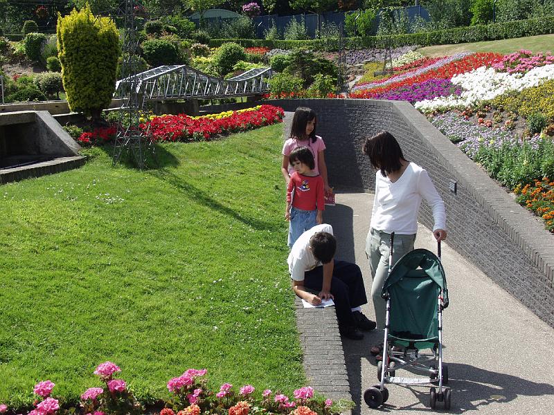 P6266437.jpg - Family near flowers and bridge.